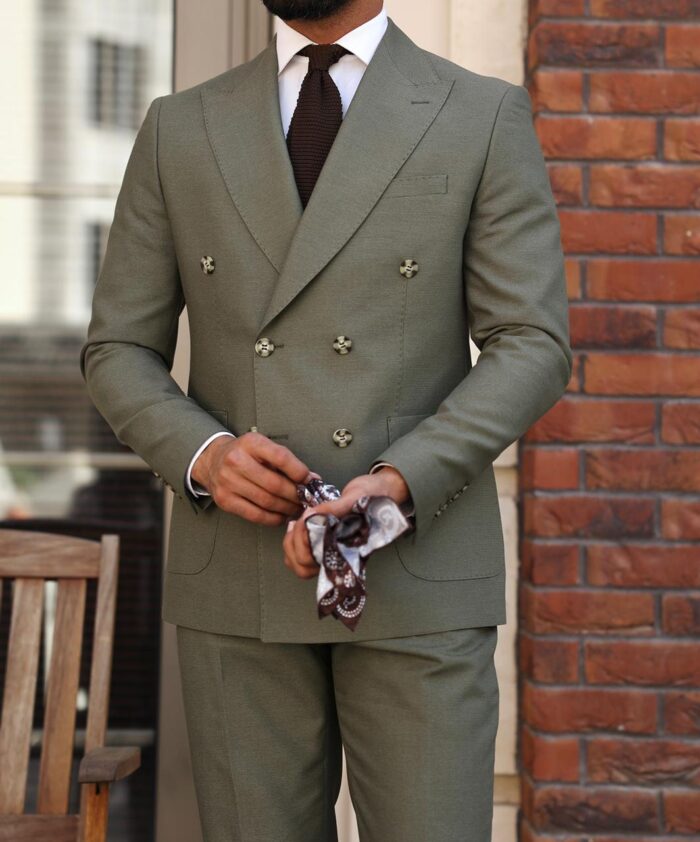 Bate Street <p>Slim fit olive green double breasted two piece men’s suit with peak lapels</p>
