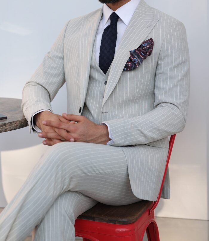 Brackenbury road <p>Slim fit light grey pinstripe three piece men’s suit with peak lapels</p>