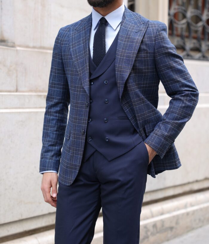 Fairbairn Road Slim fit dark blue chequered mixed three piece suit with a double breasted waistcoat and peak lapels