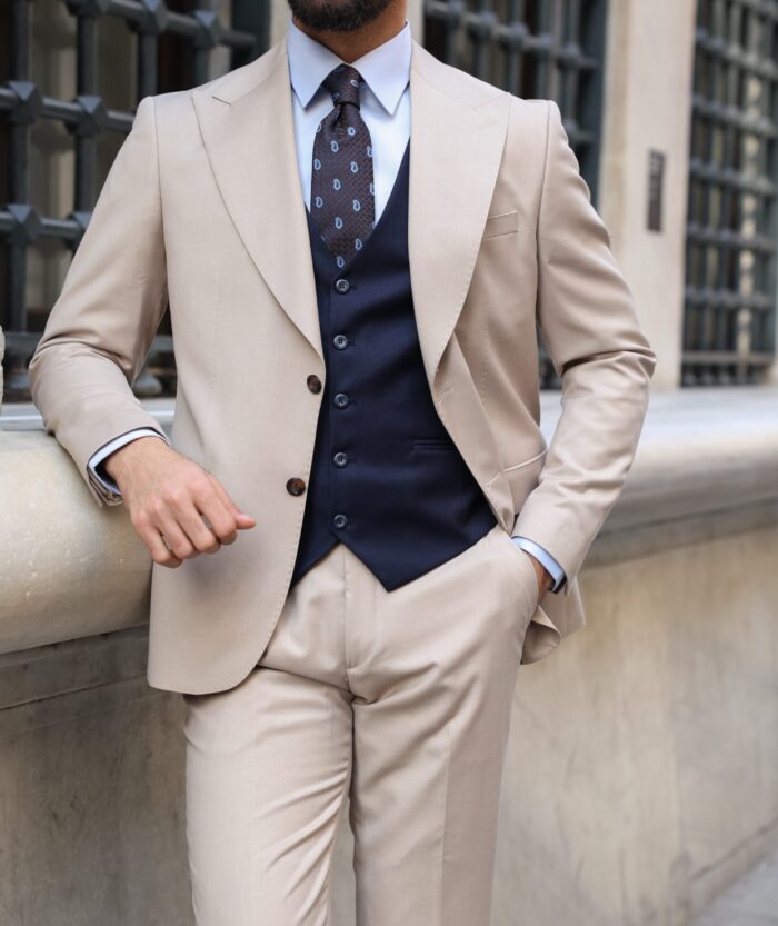 Harecourt Road <p>Slim fit cream and navy mixed three piece suit with peak lapels</p>
