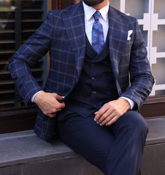 Milson Road Slim fit navy blue chequered mixed three piece suit with a double breasted waistcoat and peak lapels