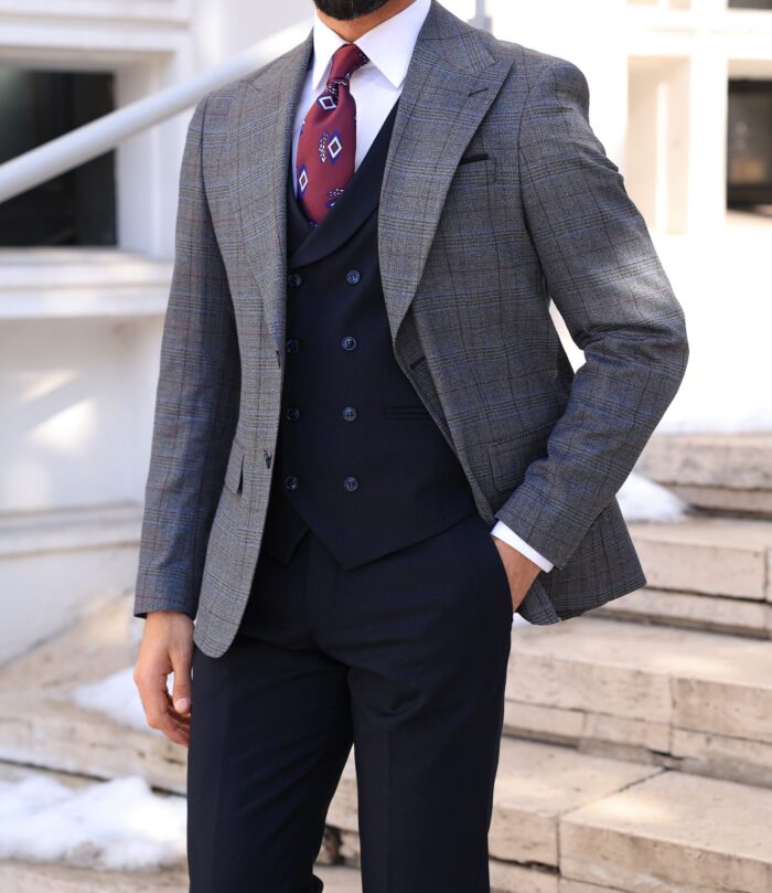 Whichcote Street <p>Slim fit light grey and black chequered mixed three piece suit with a double breasted waistcoat and peak lapels</p>
