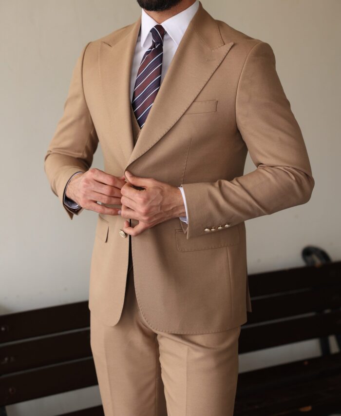Penton Mews <p>Slim fit all cream men’s three piece suit with decorative gold buttons and peak lapels</p>