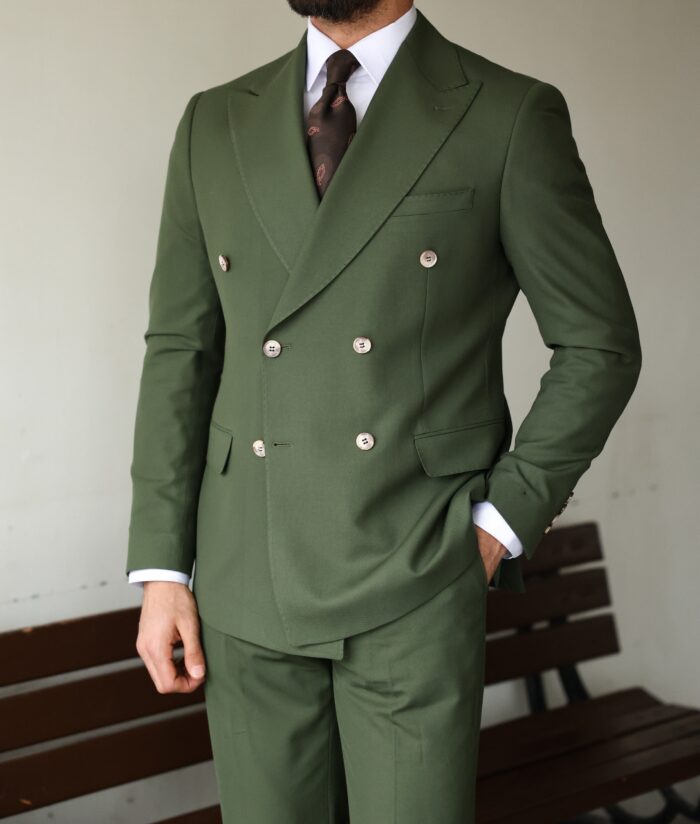 Saffron Street <p>Slim fit khaki green double breasted men’s two piece suit with decorative gold buttons and peak lapels</p>