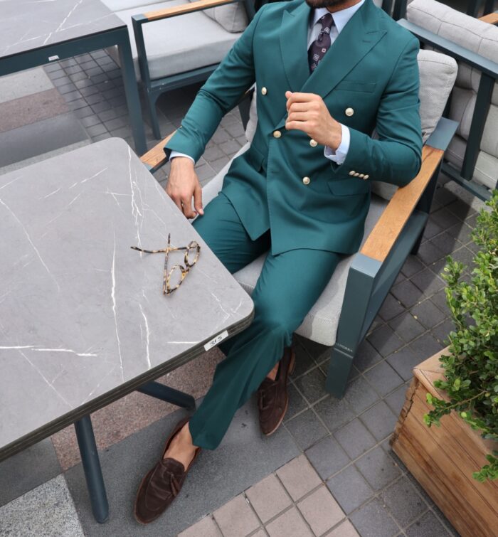 Cottons End Tailored slim fit pine green double breasted men's suit with decorative gold buttons and peak lapels