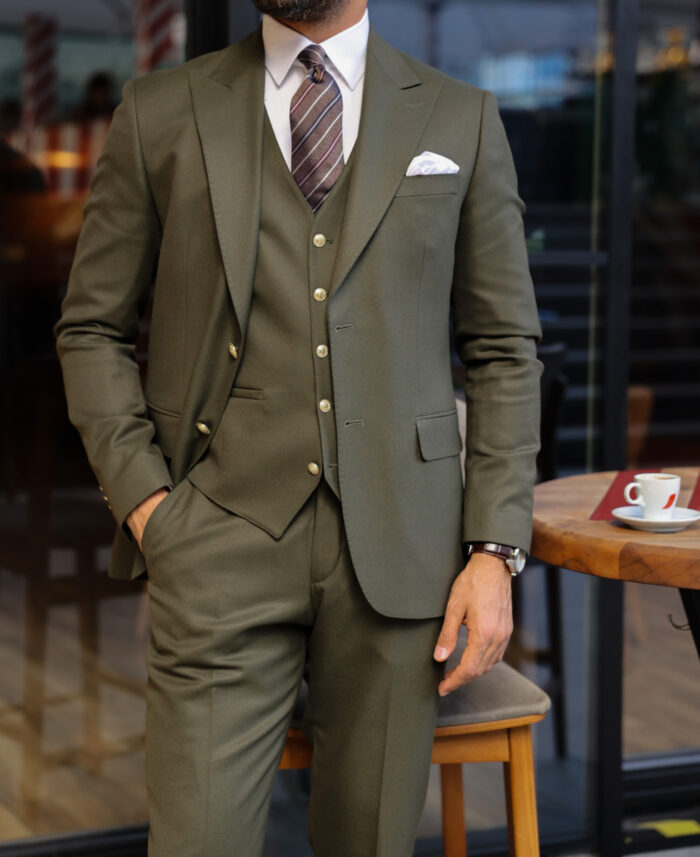 Vincent Close SLIM FIT GREEN THREE PIECE MEN’S SUIT WITH PEAK LAPELS WITH decorative gold buttons.