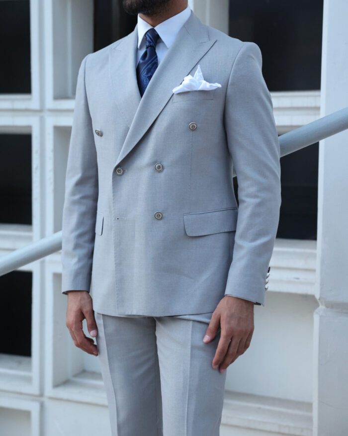 Dippers End Tailored slim fit light grey double breasted men's suit with peak lapels with decorative silver buttons