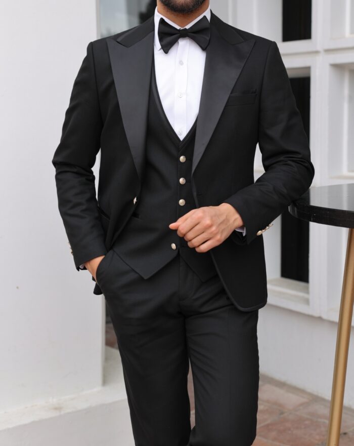 Prince Collin Tailored slim fit all black men's tuxedo with satin peak lapels  WITH DECORATIVE GOLD BUTTONS.