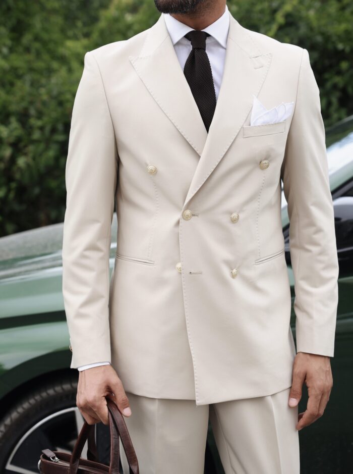 Shepard’s Close Tailored slim fit cream double breasted men's suit with peak lapels with decorative gold buttons