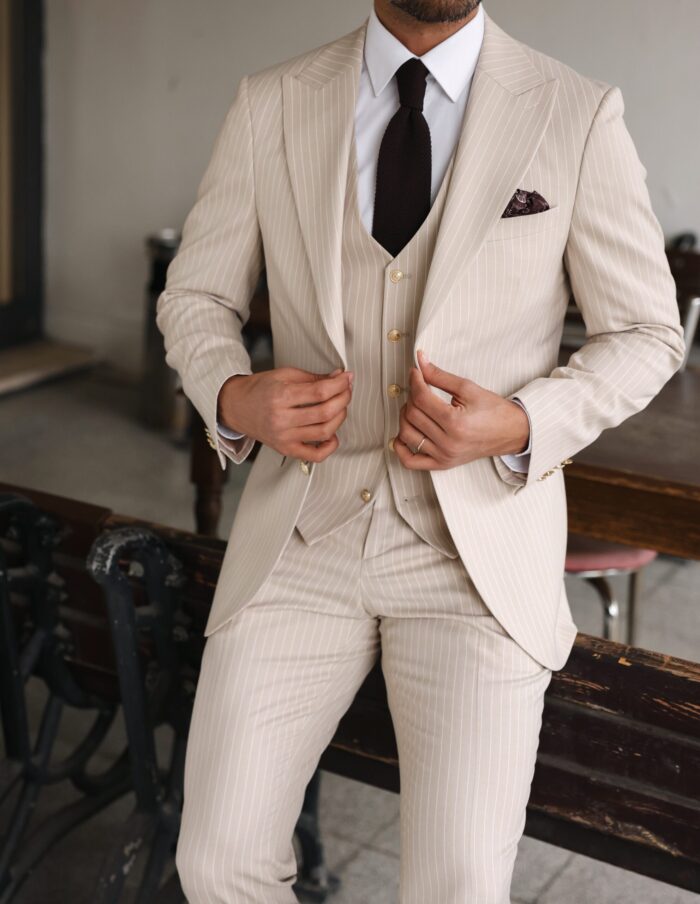 Lytham Road Slim fit cream men’s three piece suit with peak lapels and with decorative gold buttons