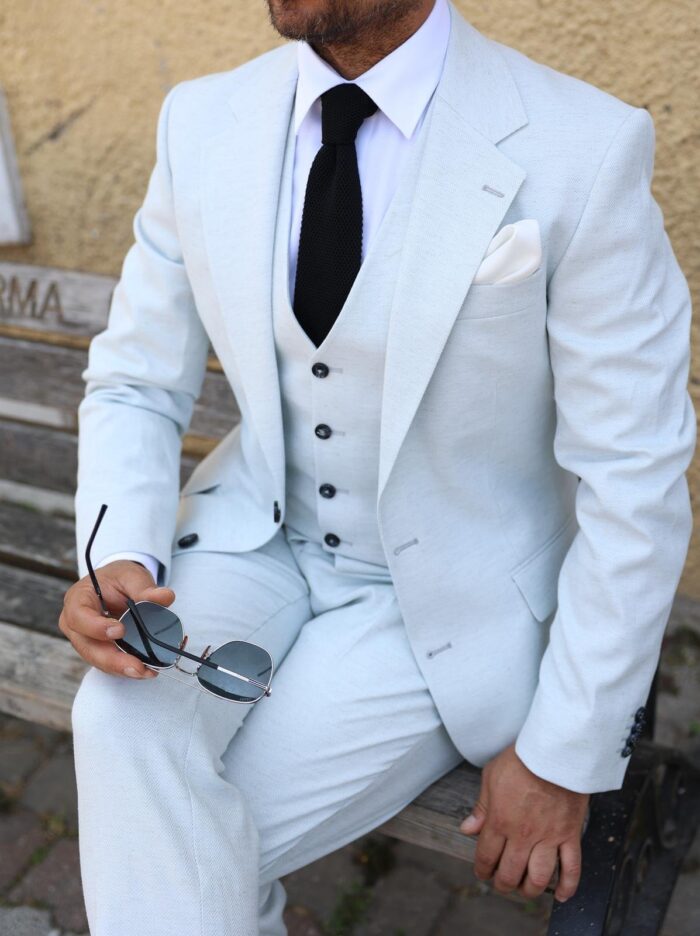 Inigo Place Slim fit stone herringbone men’s three piece suit with notch lapels