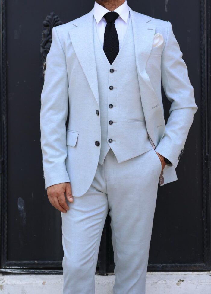 Inigo Place <p>Slim fit ice blue stone herringbone men’s three piece suit with notch lapels</p>
