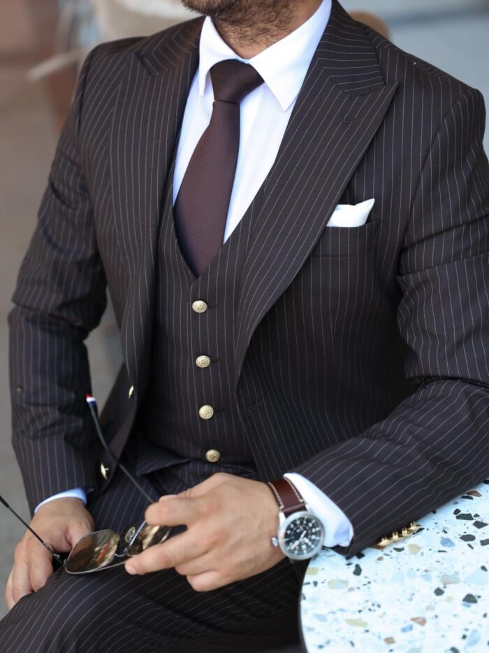 Fenwick Court Slim fit brown men’s three piece suit with peak lapels and with decorative gold buttons