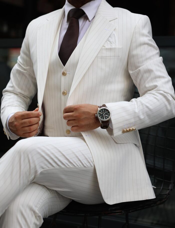 Axminster Road Slim fit cream men’s three piece suit with notch lapels and with decorative gold buttons