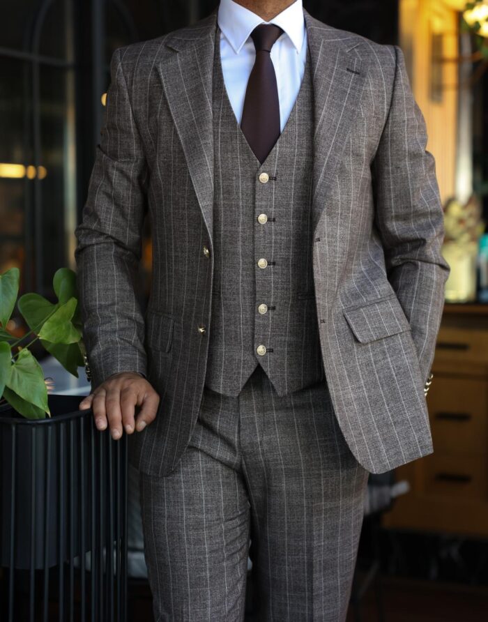 Brune Street Slim fit latte brown men’s three piece suit with peak lapels and with decorative gold buttons