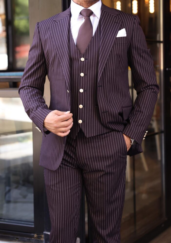 Mawbey Place Slim fit burgundy men’s three piece suit with peak lapels and with decorative gold buttons