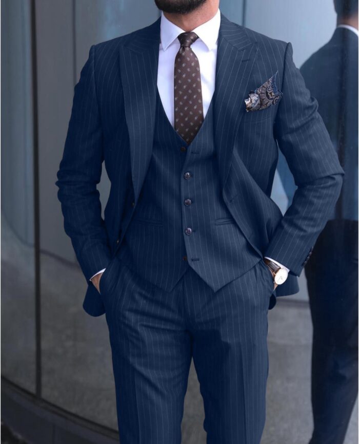 Cheney Road <p>Slim fit navy pinstripe men’s three piece suit with peak lapels</p>
