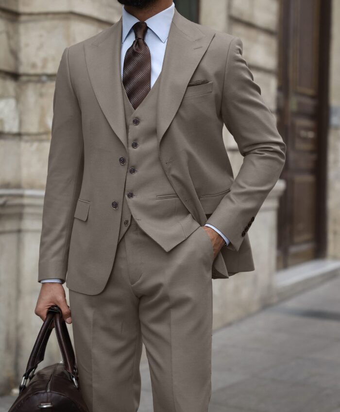 Gilkes Crescent Slim fit taupe three piece men’s suit with peak lapels