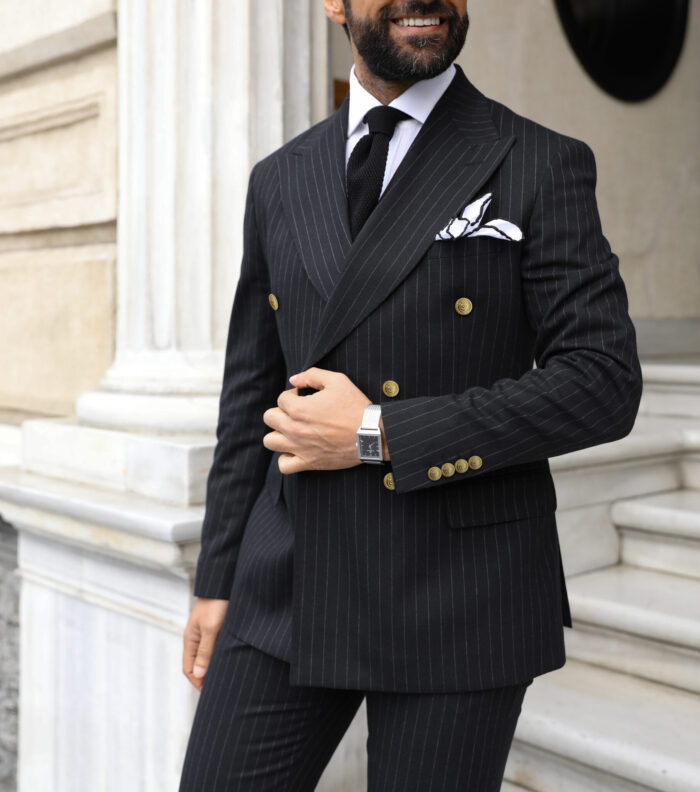 Poynter Street Tailored slim fit black double breasted pin striped men’s suit with peak lapels with decorative gold buttons
