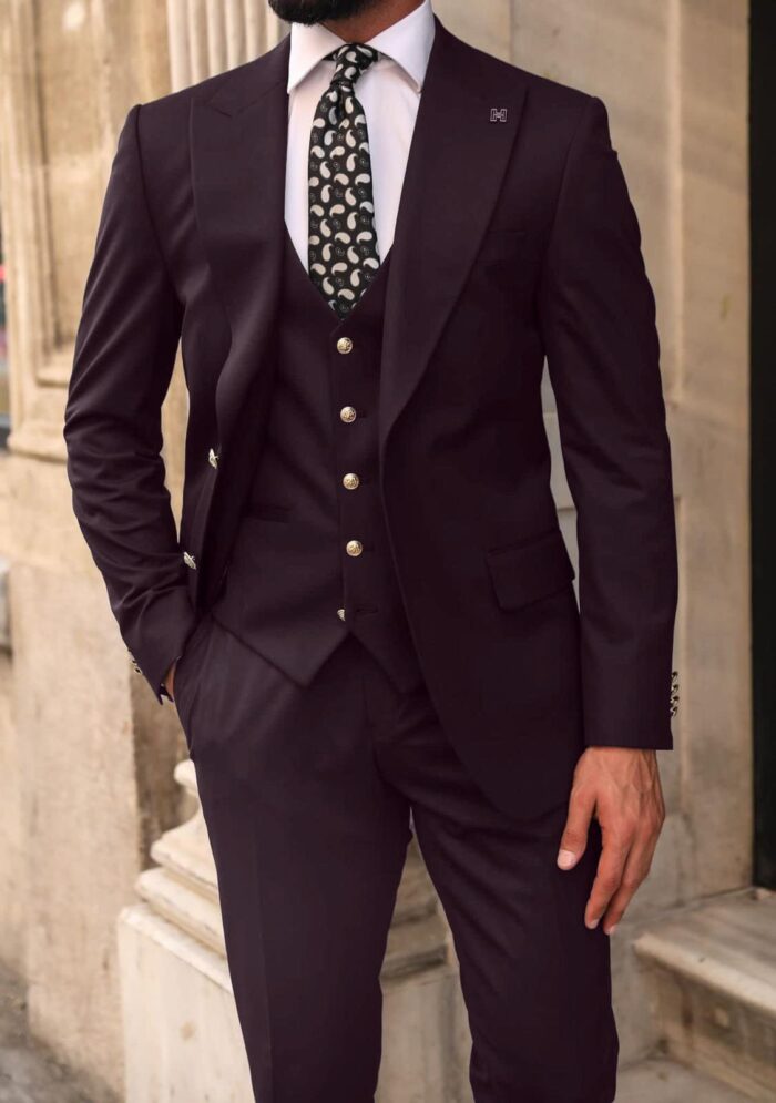 Dunmaston Mews Slim fit burgundy plum men’s three piece suit with decorative gold buttons and peak lapels