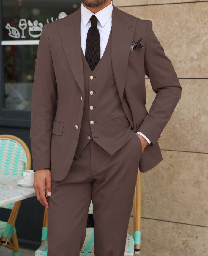 Tasker Road Slim fit chocolate coloured three piece men’s suit with a peak lapels With decorative gold buttons