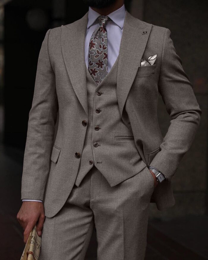 Buckfast Street Slim fit taupe three piece men’s suit with peak lapels