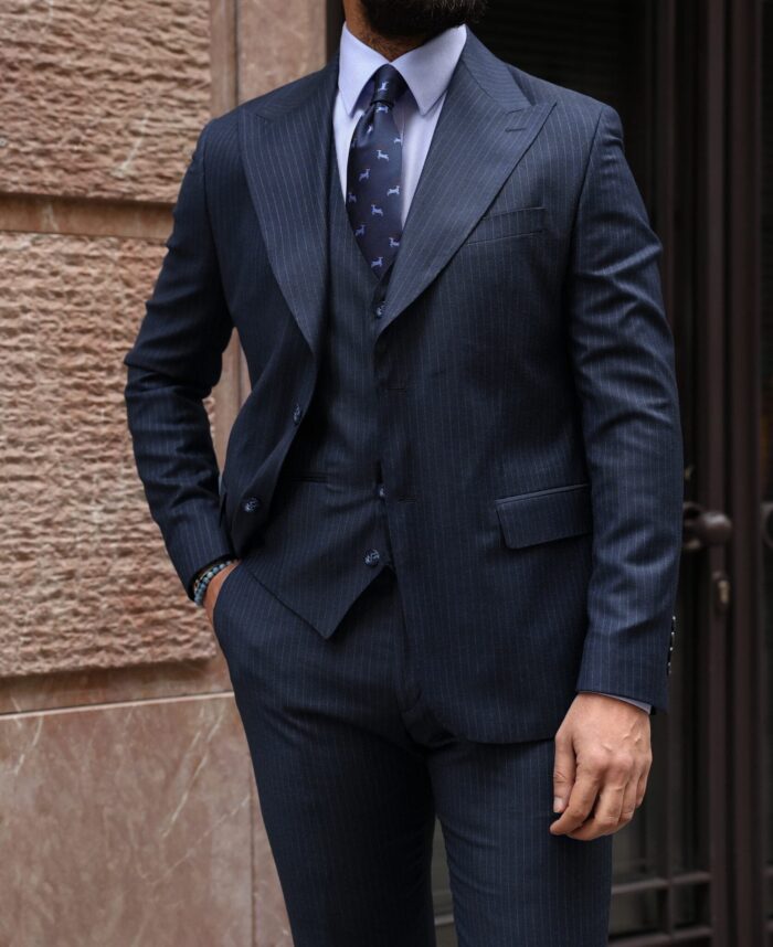 Chudleigh Street Slim fit navy pinstripe men’s three piece suit with peak lapels